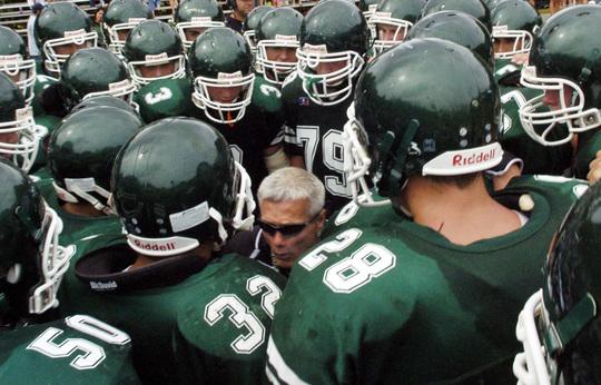 West Newbury: Pentuckets head coach Steve Hayden huddles with his players as they get ready for the 2nd half action. North Reading Football team defeted Pentucket High School 8-6. Photo by Tim Jean/Eagle-Tribune Saturday, September 06, 2008