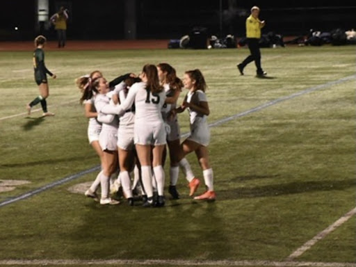 Celebration after a goal scored by Lia Goodwin to tie up the game. 


Photo Source:  Erin Cloutier. 