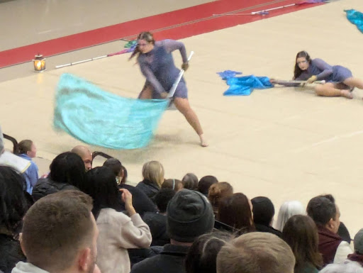 Photo shows Rose Shanahan in the middle of her current competition winning routine, spinning a flag.
